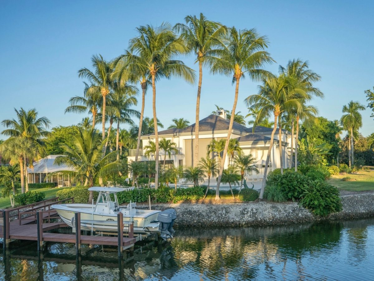 Waterfront villa with mature landscaping